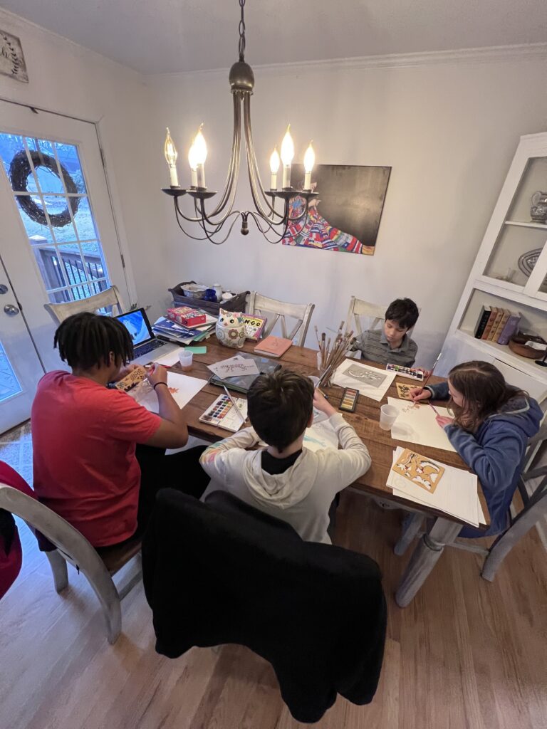 How to start learning english online in a creative home setting with children working together at a table