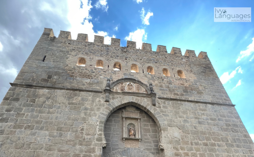 Essential vocabulary for English beginners in a travel learning scene at an ancient city entrance