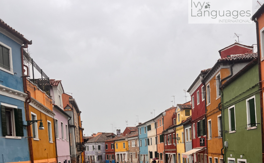 How to practice English pronunciation alone while exploring a colorful canal street in the rain