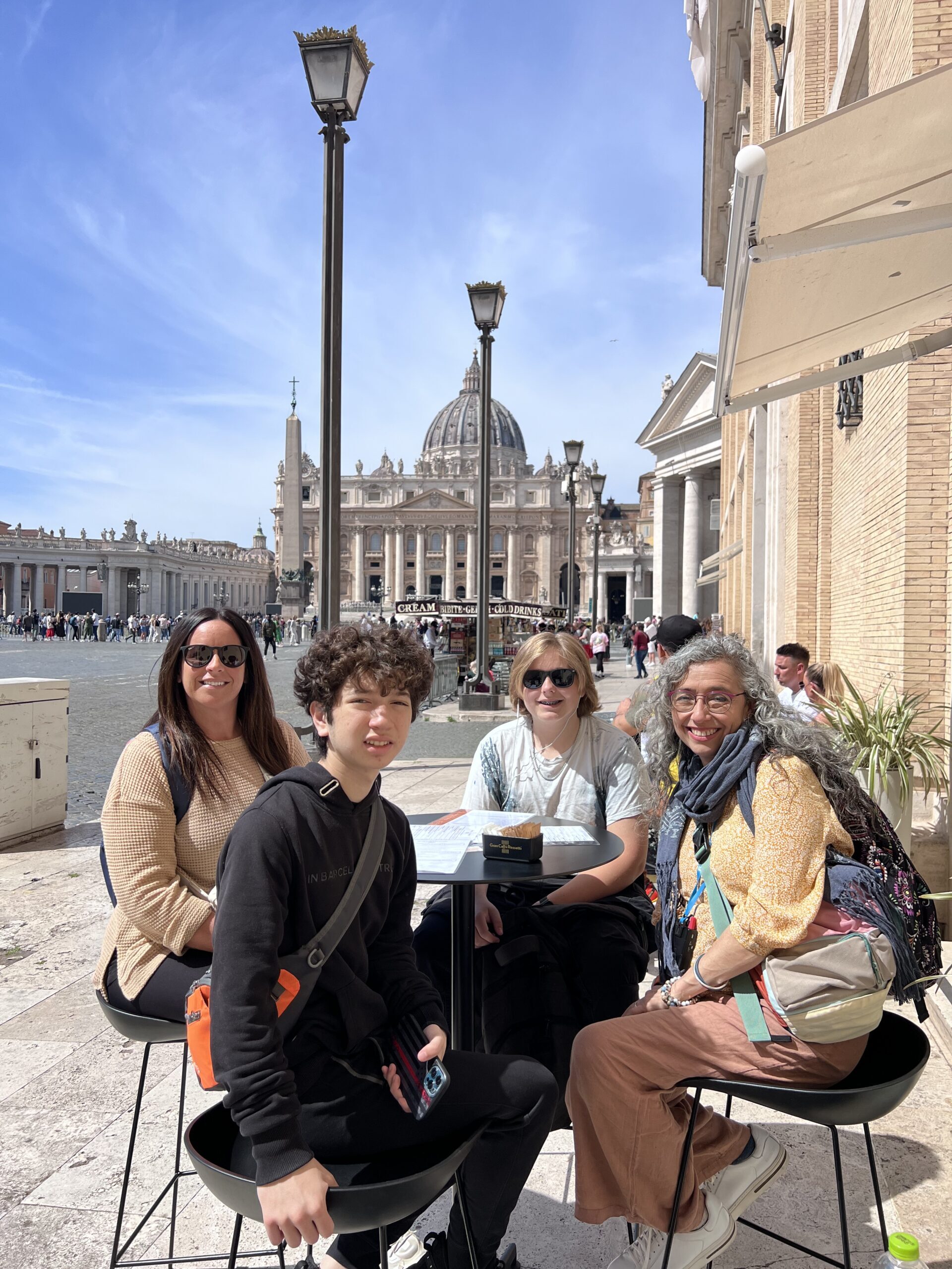 Ivy Languages students enjoying a cafe in Rome with St Peters Basilica in background