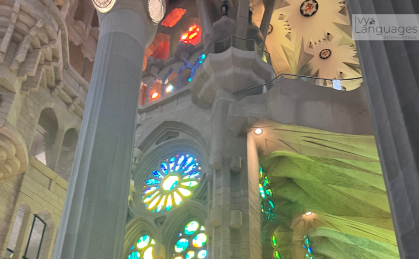 Mastering basic English grammar rules inside a cathedral with colorful stained glass and visitors