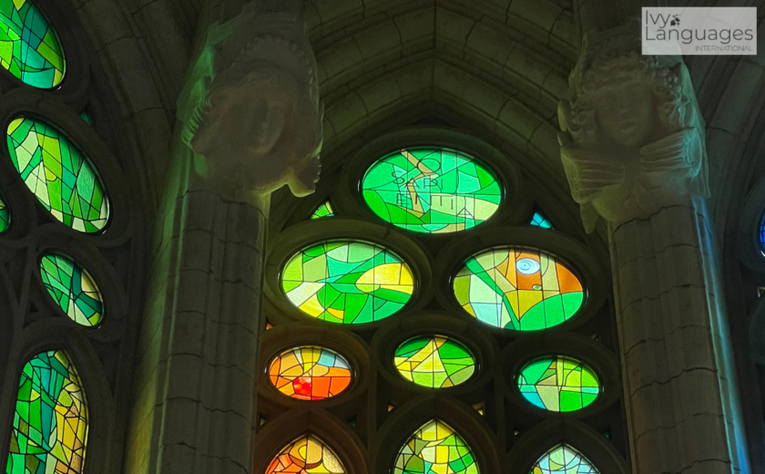 Overcoming Fear of Speaking English reflected through colorful stained glass in a quiet, reflective space