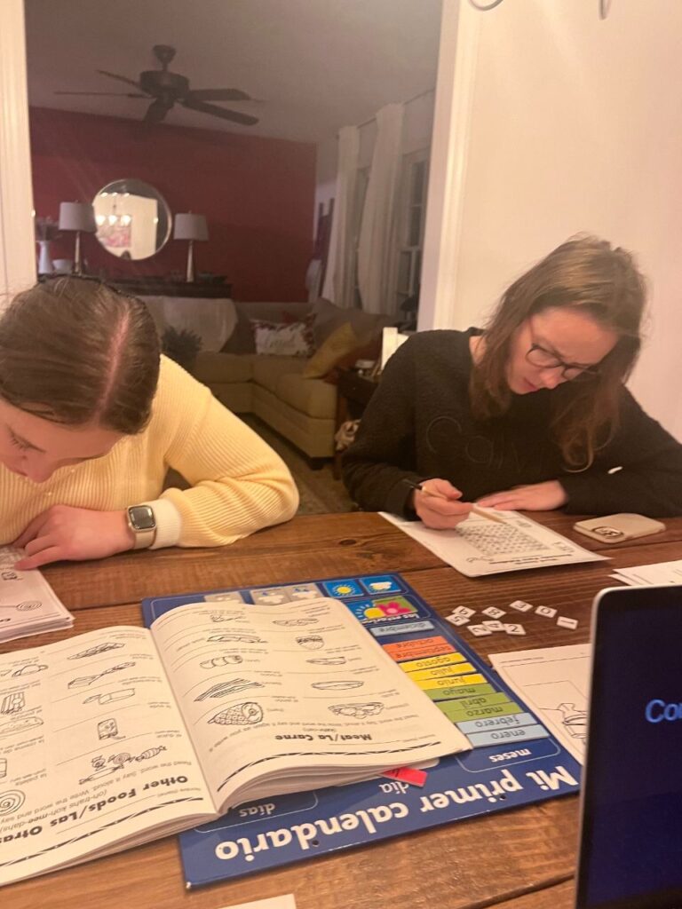 Learners using reading materials for intermediate level to build vocabulary and comprehension skills together.