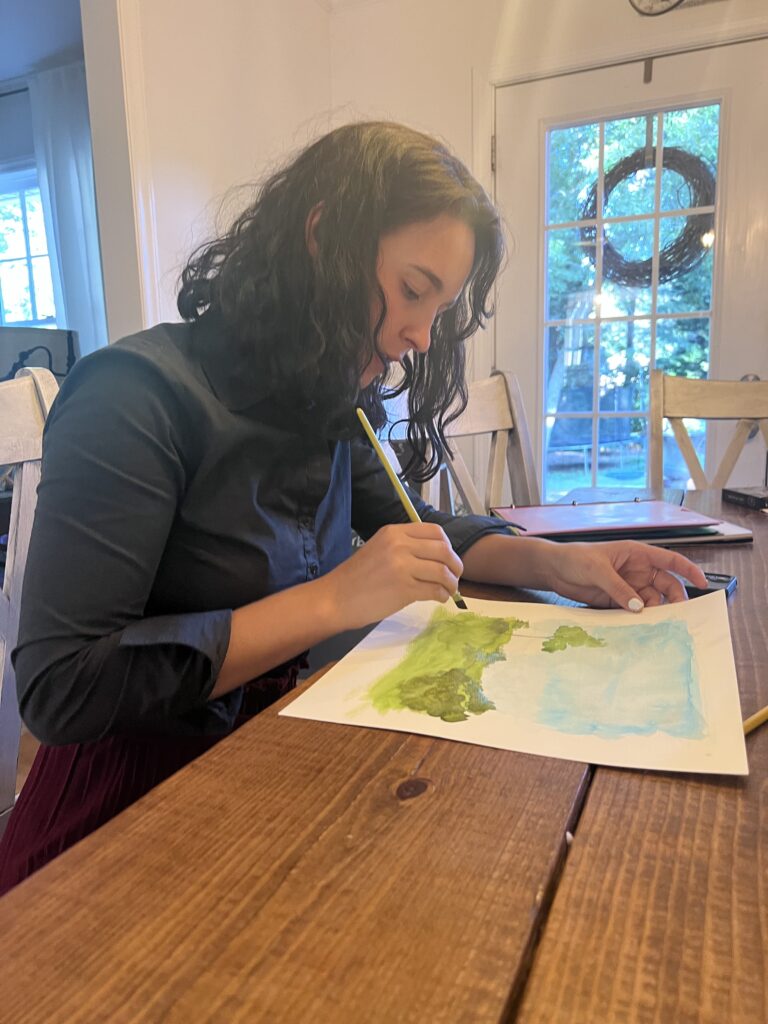 Student practicing writing sophisticated english essays while working at a table