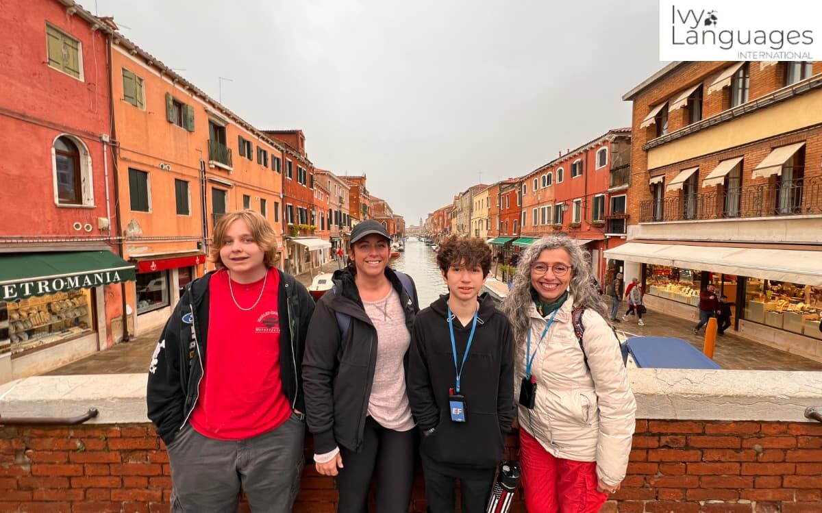 Advanced listening skills built through real-world immersion, Ivy Languages group on Murano canal bridge in Venice