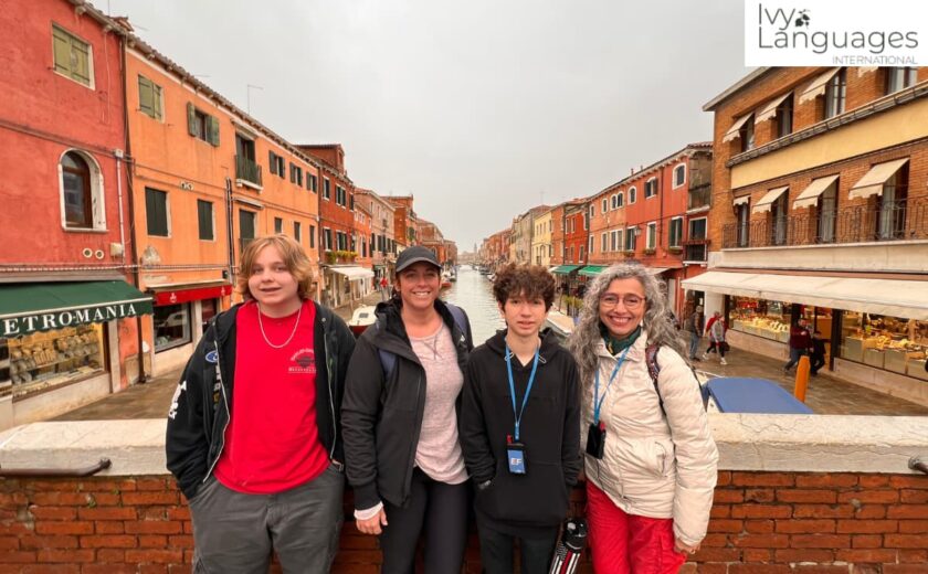 Advanced listening skills built through real-world immersion, Ivy Languages group on Murano canal bridge in Venice 