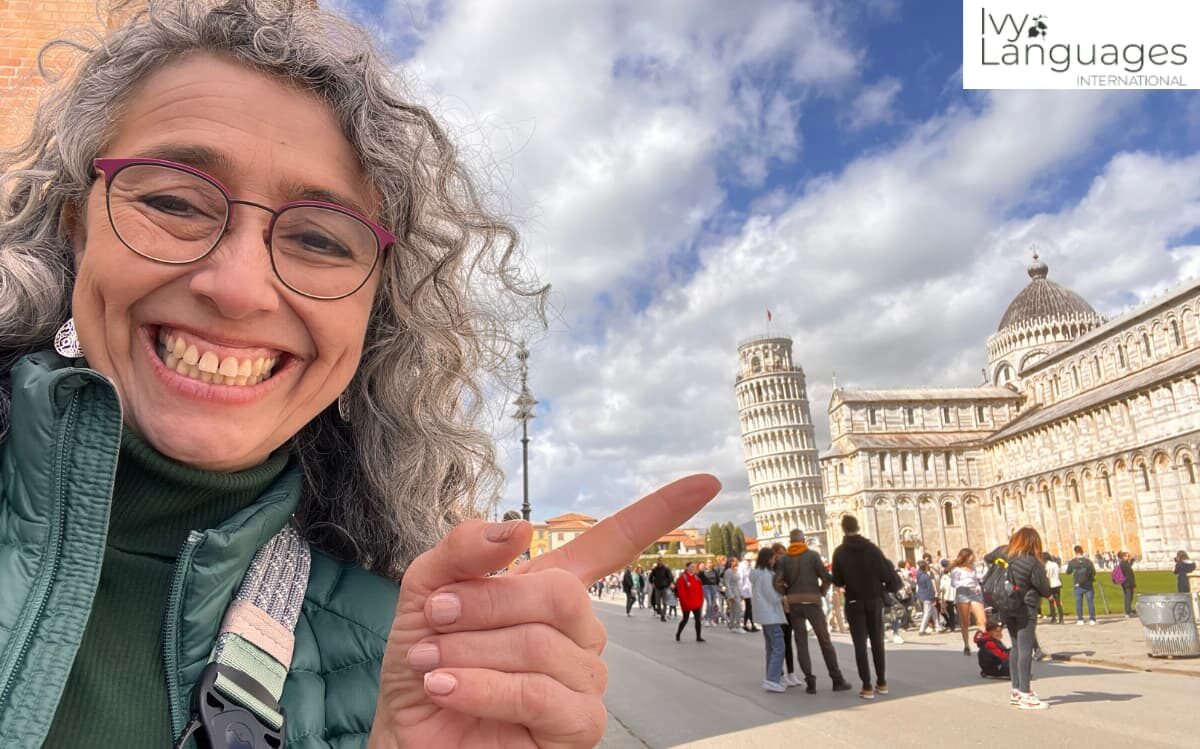 Mastering complex English grammar through immersive travel, Ivy Languages instructor at the Leaning Tower of Pisa