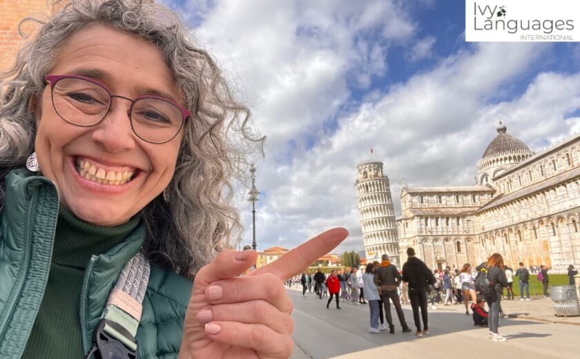 Mastering complex English grammar through immersive travel, Ivy Languages instructor at the Leaning Tower of Pisa
